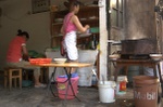 A Mei cooking in her kitchen.
