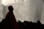 A red witch behind the falls