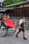 A geisha on her way to perform