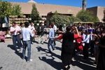 A wedding party breaks into dance in the middle of the street